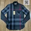 Áo Burberry dài tay mầu đen kẻ đỏ túi chéo dáng ôm